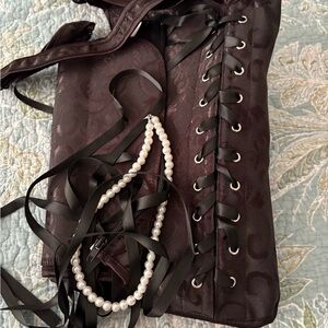 Elegant Black Corset with Pearl Necklace